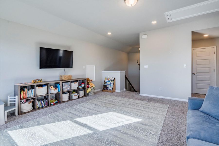Upstairs game room with hill country views.