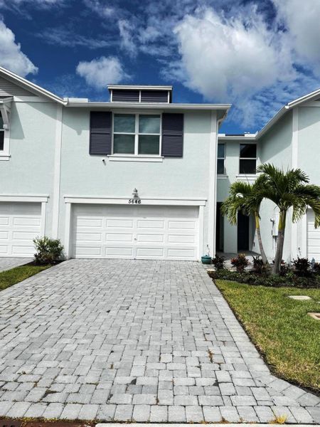 Front exterior of a new home in , Stuart, FL, highlighting curb appeal (Image 1).