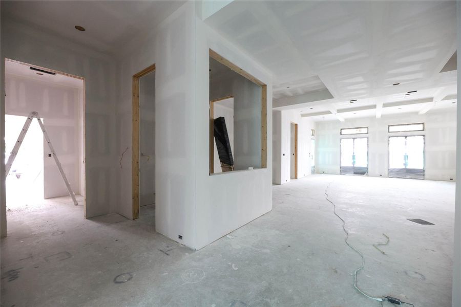 Wet Bar is located across from the Kitchen as you enter the Family Room, equipped with beverage fridge and sink.