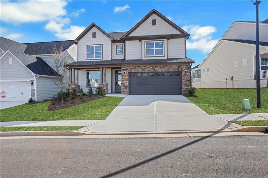 Front exterior of a new home in Twin Lakes, Hoschton, GA, highlighting curb appeal (Image 23).