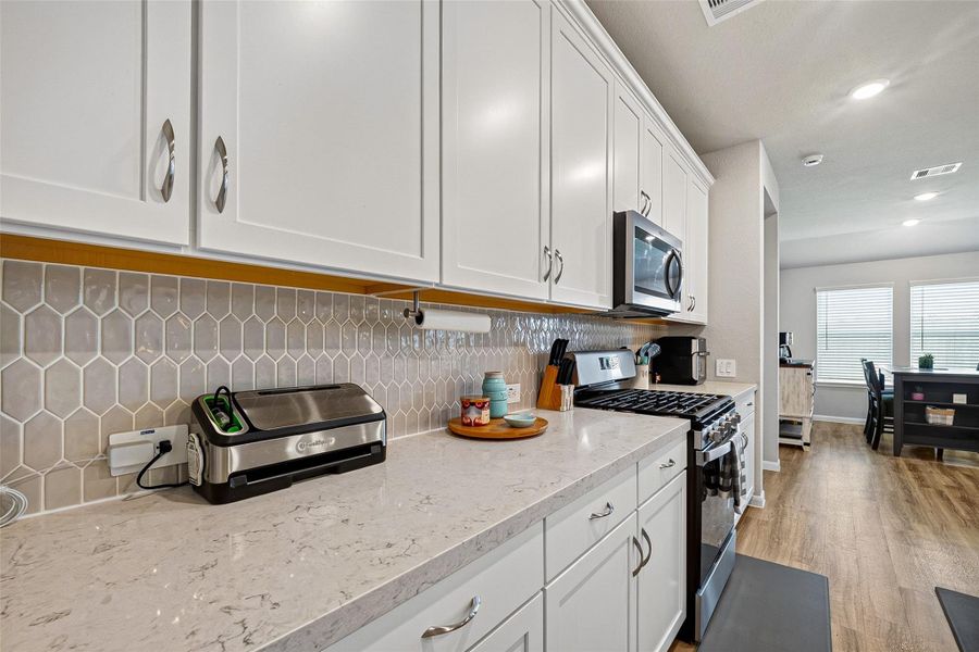 Furnished interior view inside a new home in Sweetgrass Village, Crosby (Image 5).