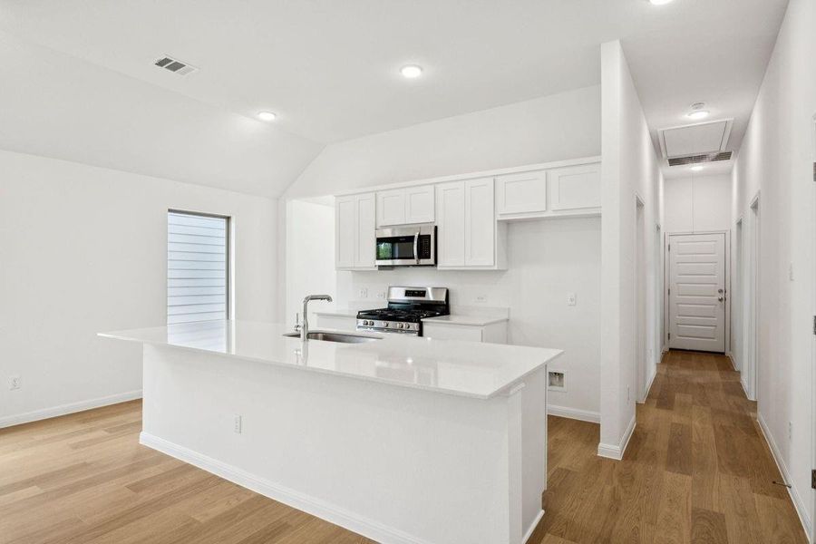 Kitchen in the Spruce home plan by Trophy Signature Homes - REPRESENTATIVE PHOTO