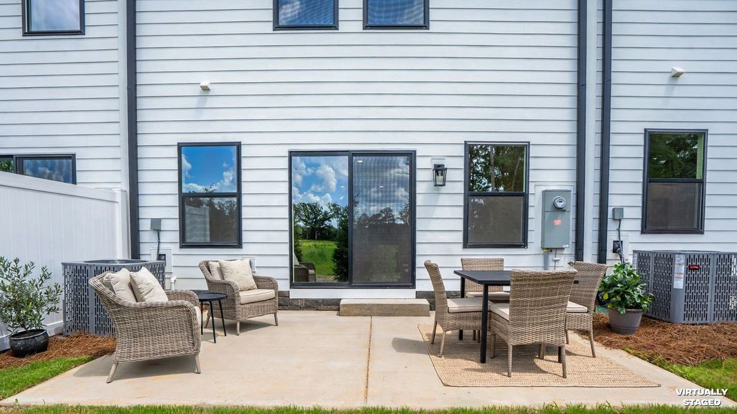 Exterior details and patio area of a home in The Ridge Townhomes, Monroe (Image 1). Exterior details and patio area of a home in The Ridge Townhomes, Monroe (Image 1).