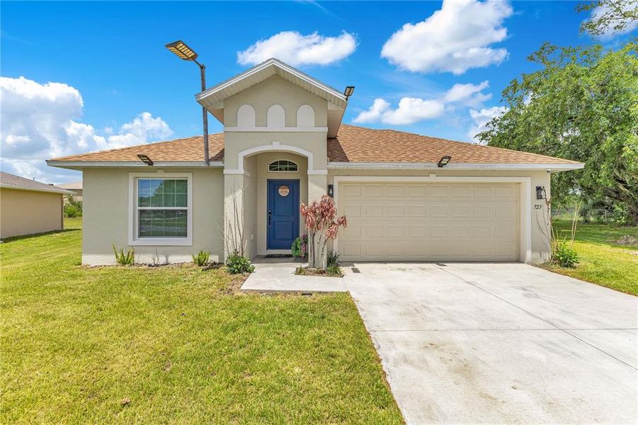 Front exterior of a new home in , Poinciana, FL, highlighting curb appeal (Image 1). Front exterior of a new home in , Poinciana, FL, highlighting curb appeal (Image 1).