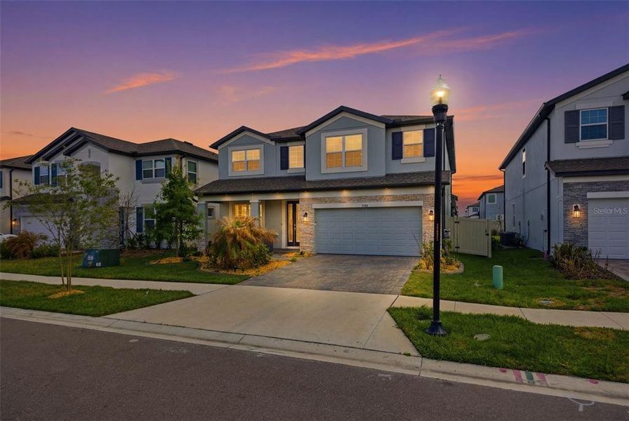 Front exterior of a new home in Whispering Oaks Preserve, Wesley Chapel, FL, highlighting curb appeal (Image 1). Front exterior of a new home in Whispering Oaks Preserve, Wesley Chapel, FL, highlighting curb appeal (Image 1).