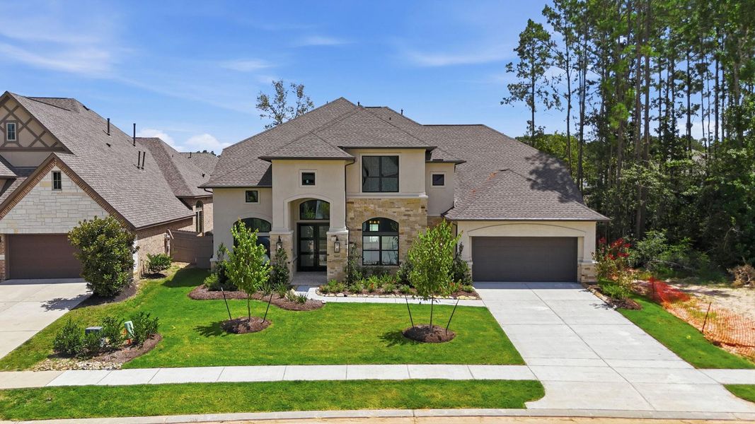Front exterior of a new home in Artavia 70′, Conroe, TX, highlighting curb appeal (Image 23).