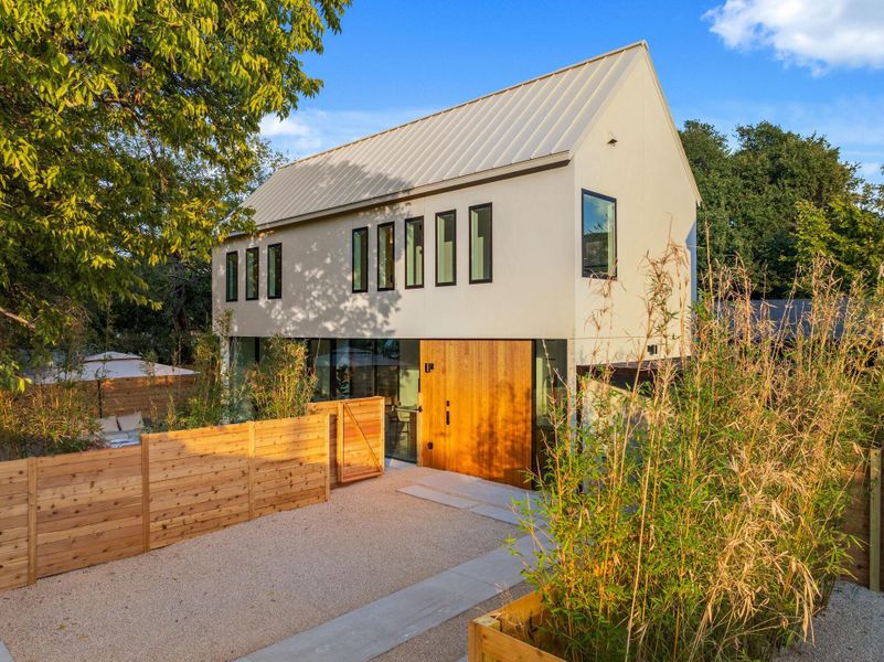 Front exterior of a new home in , Austin, TX, highlighting curb appeal (Image 1). Front exterior of a new home in , Austin, TX, highlighting curb appeal (Image 1).