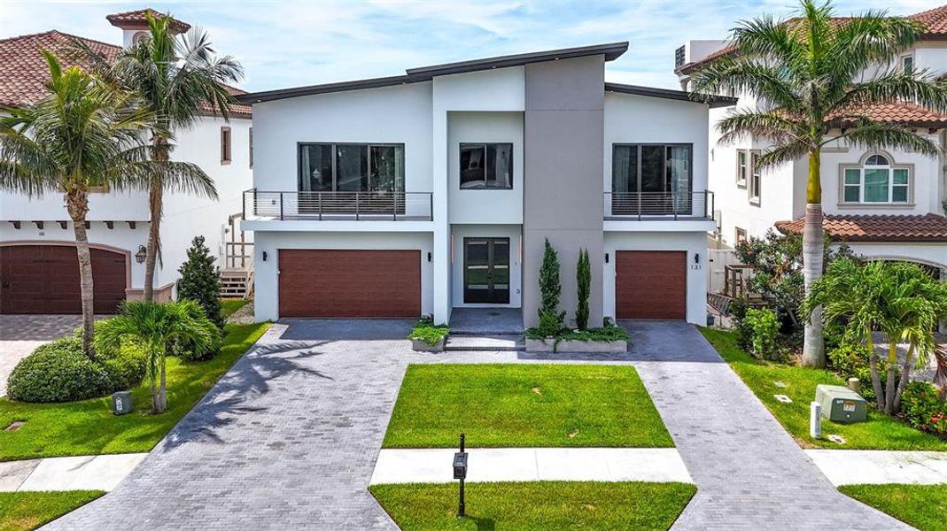 Front exterior of a new home in , Redington Shores, FL, highlighting curb appeal (Image 22).