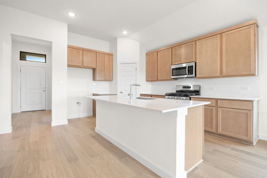 Kitchen in the Turquoise home plan by Trophy Signature Homes – REPRESENTATIVE PHOTO