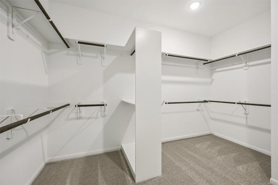 Walk-in closet in the primary suite (*Photo not of actual home and used for illustration purposes only.) Walk-in closet in the primary suite (*Photo not of actual home and used for illustration purposes only.)