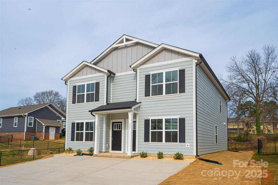Front exterior of a new home in , Hickory, NC, highlighting curb appeal (Image 14).