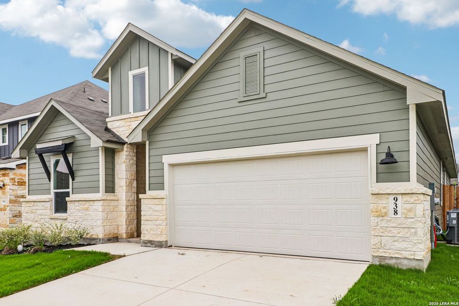 Front exterior of a new home in Estancia Ranch - Classic Series, San Antonio, TX, highlighting curb appeal (Image 30).