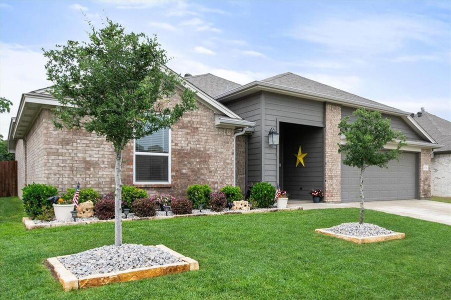 Front exterior of a new home in Willow Vista Estates, Saginaw, TX, highlighting curb appeal (Image 21).