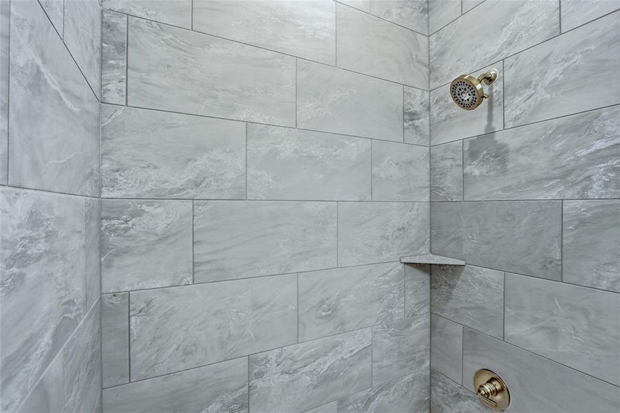 Bathroom view of tiled shower