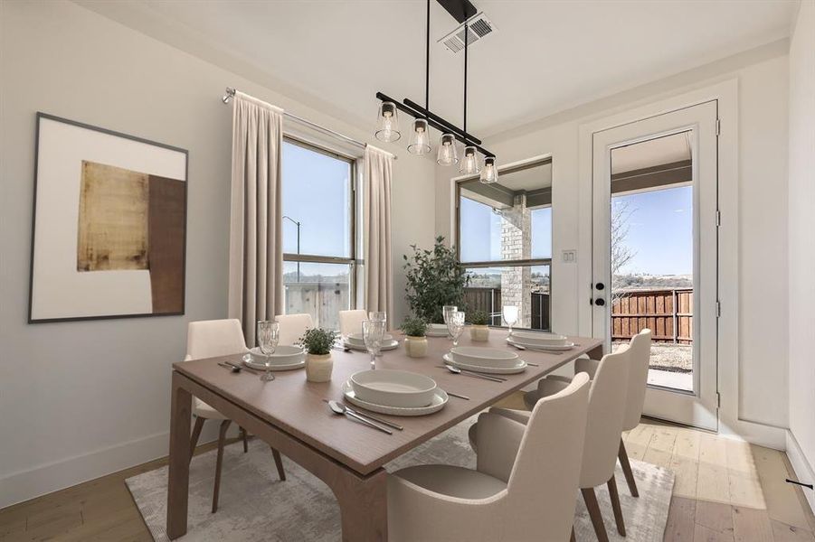 Virtually Staged Photo Dining room with light wood-style floors and baseboards