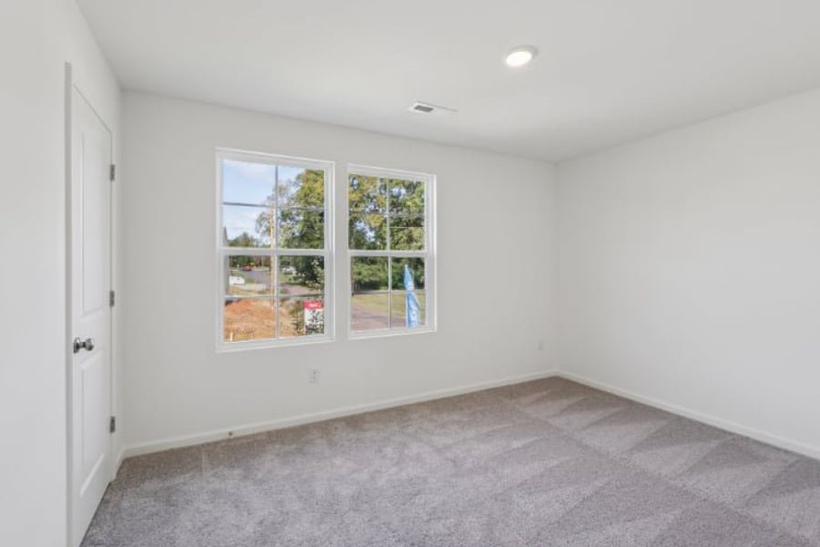 A room with a window and a door. A room with a window and a door.