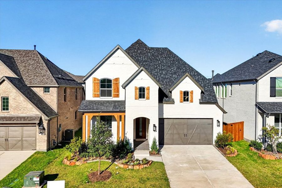 Front exterior of a new home in Aster Park, McKinney, TX, highlighting curb appeal (Image 1). Front exterior of a new home in Aster Park, McKinney, TX, highlighting curb appeal (Image 1).