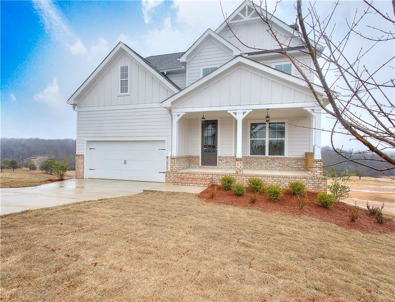 Front exterior of a new home in , Homer, GA, highlighting curb appeal (Image 25).