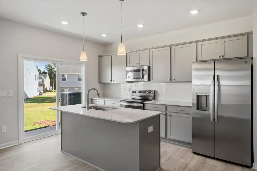 Furnished interior view inside a new home in West Main Townhomes, Sanford (Image 6).