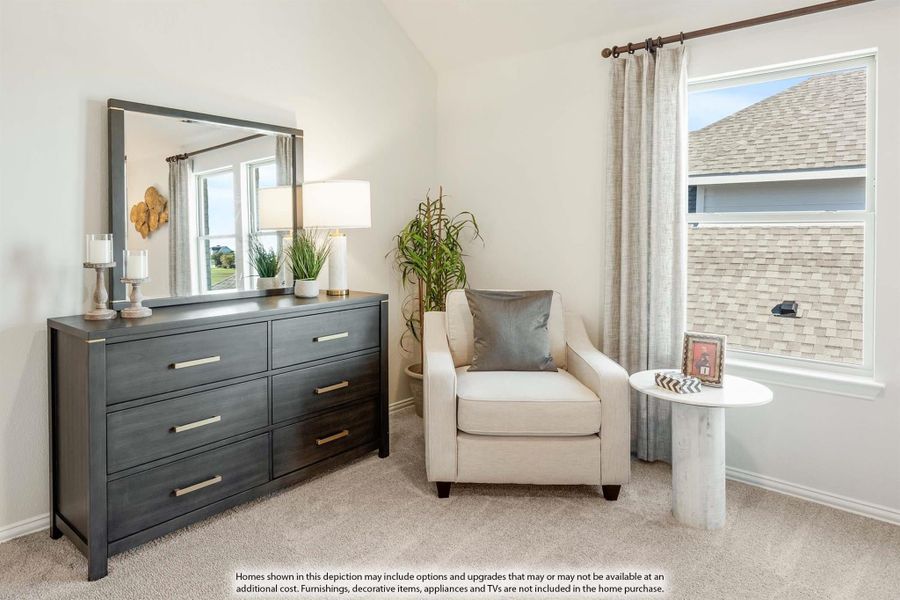 Bedroom corner with dark wood dresser, mirror, accent chair, and carpet flooring near a large window