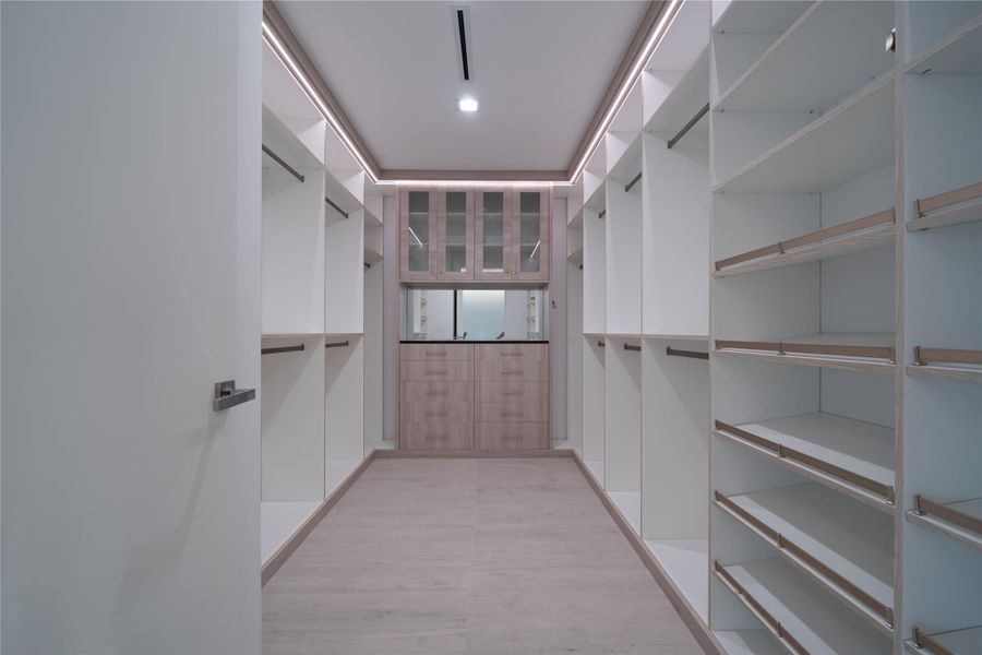 Primary Bedroom Walk-in closet Primary Bedroom Walk-in closet