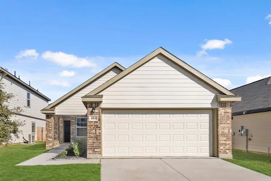 Front exterior of a new home in Hanna Ranch, Everman, TX, highlighting curb appeal (Image 1).
