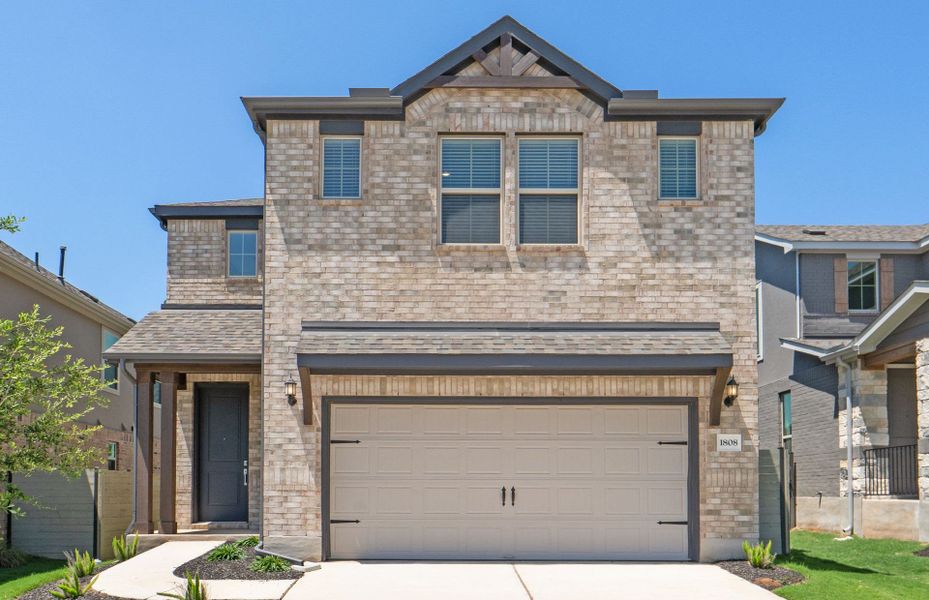 Front exterior of a new home in Wolf Ranch, Georgetown, TX, highlighting curb appeal (Image 24).