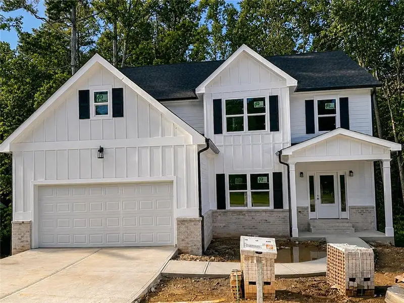 Front exterior of a new home in , Norcross, GA, highlighting curb appeal (Image 1). Front exterior of a new home in , Norcross, GA, highlighting curb appeal (Image 1).