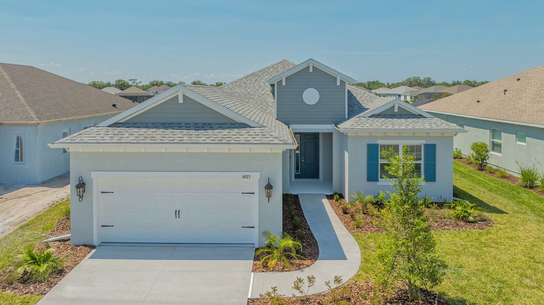 Representative exterior photo of a completed home built from the Harvest 3 by Neal Communities in Canoe Creek, Parrish, FL (Image 16). Representative exterior photo of a completed home built from the Harvest 3 by Neal Communities in Canoe Creek, Parrish, FL (Image 16).