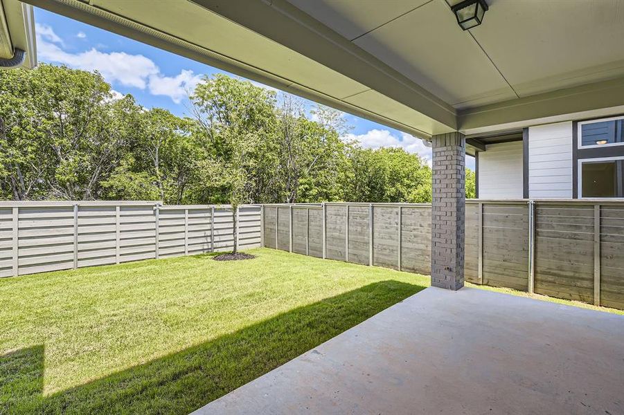 View of yard with a patio area View of yard with a patio area
