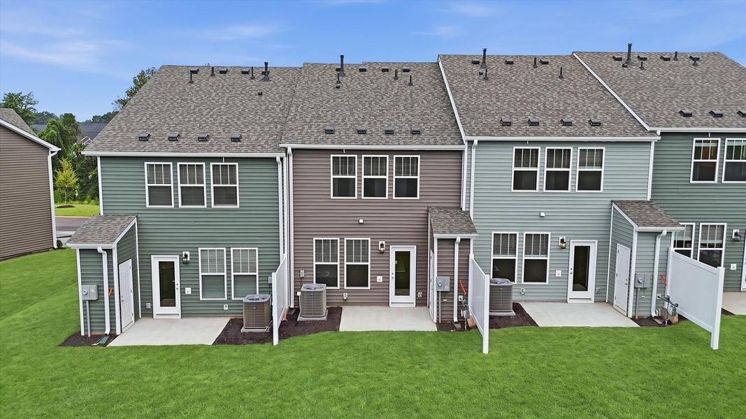 Notable exterior includes a rear covered porch designed for year-round enjoyment by DRB Homes