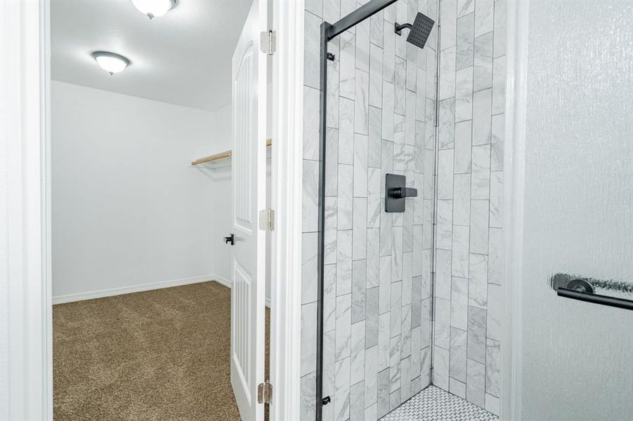 Bathroom with a shower with door