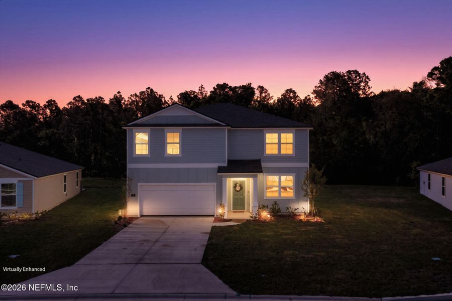 Front exterior of a new home in Entrada, St. Augustine, FL, highlighting curb appeal (Image 2). Front exterior of a new home in Entrada, St. Augustine, FL, highlighting curb appeal (Image 2).