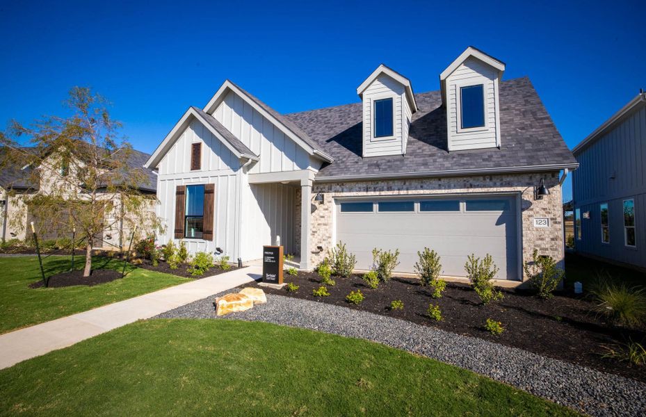Representative exterior photo of a completed home built from the Prestige by Del Webb in Del Webb Austin at Lost Pines, Bastrop, TX (Image 32).