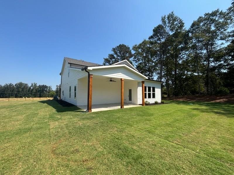Front exterior of a new home in Pinegate, Covington, GA, highlighting curb appeal (Image 17). Front exterior of a new home in Pinegate, Covington, GA, highlighting curb appeal (Image 17).