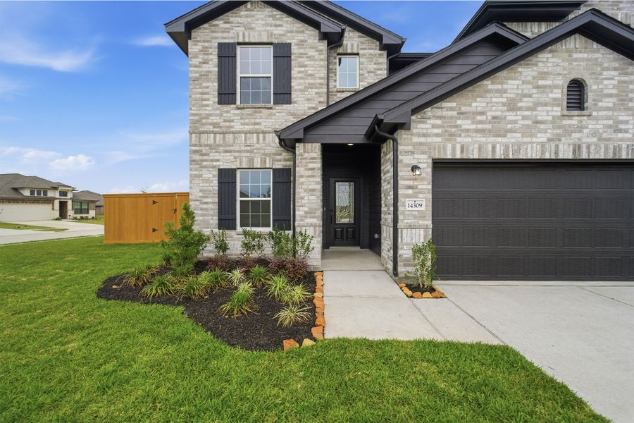 Front exterior of a new home in Lago Mar, Texas City, TX, highlighting curb appeal (Image 24).