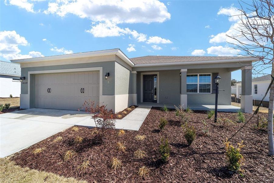 Front exterior of a new home in , Ocala, FL, highlighting curb appeal (Image 22).