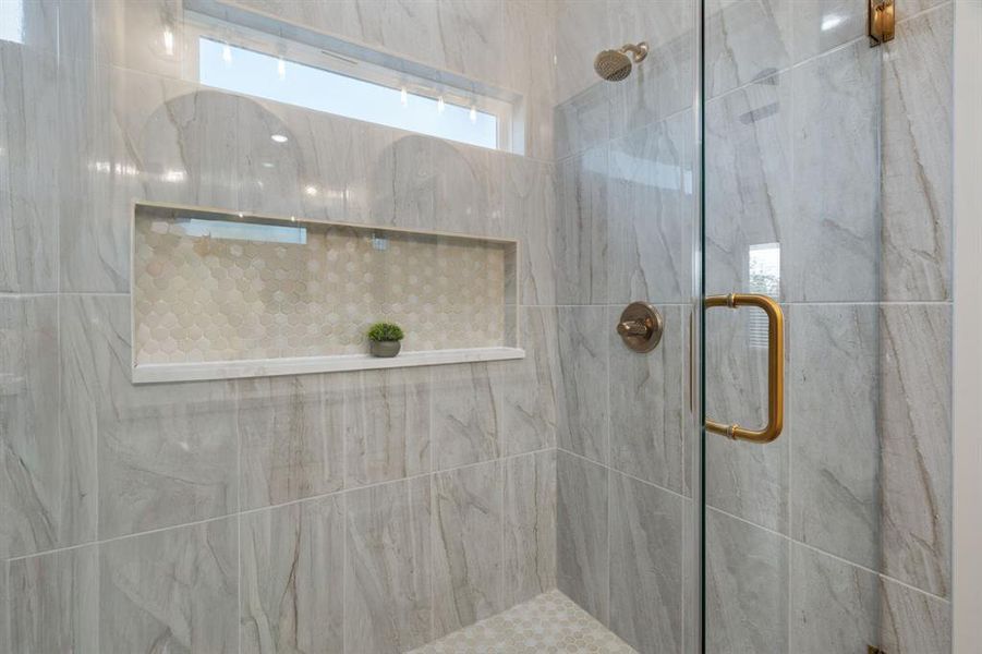 Bathroom with a marble finish shower