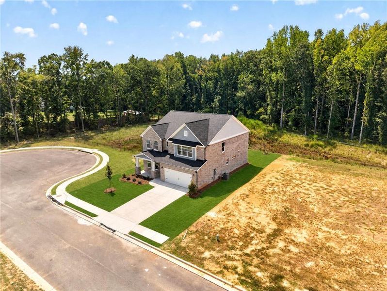 Front exterior of a new home in , Loganville, GA, highlighting curb appeal (Image 26). Front exterior of a new home in , Loganville, GA, highlighting curb appeal (Image 26).