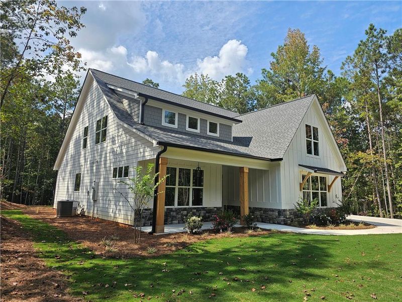 Front exterior of a new home in , Douglasville, GA, highlighting curb appeal (Image 21).