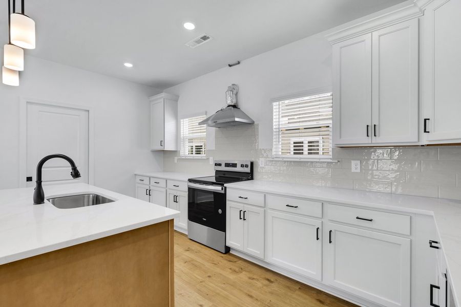 Representative furnished interior of a home built from the Titusville II by Regent Homes in Marlon's Creek, Spring Hill (Image 9).