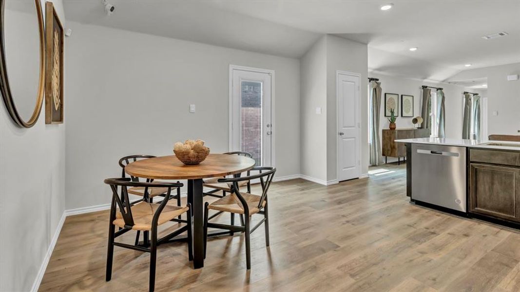 Dining area featuring light wood-style flooring and recessed lighting Dining area featuring light wood-style flooring and recessed lighting