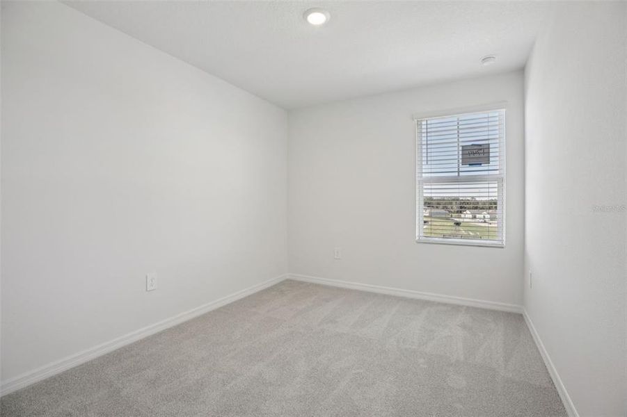 Spacious, unfurnished interior of a new home in The Reserve at Hammock Oaks Townes, Lady Lake (Image 36).