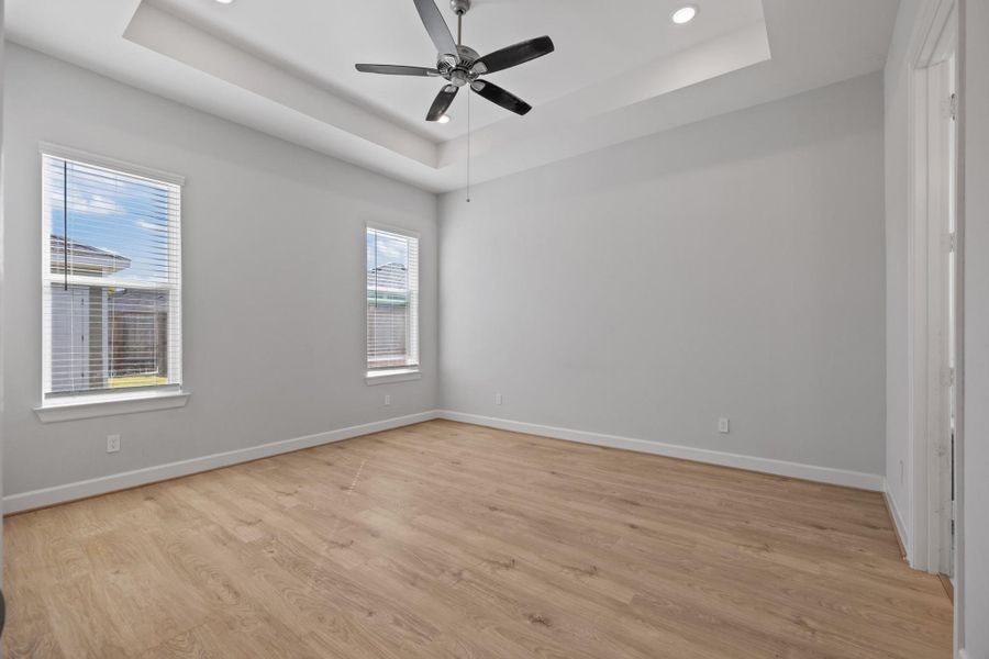 Primary Bedroom with vaulted ceiling and ceiling fan