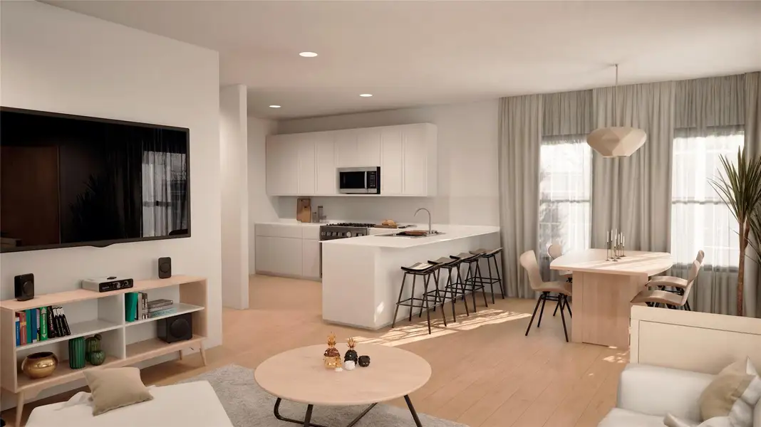 Living room with light wood-type flooring and recessed lighting