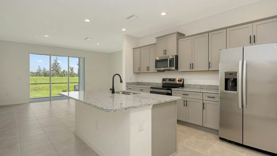 Furnished interior view inside a new home in Palm Grove Real Estate and Homes for Sale in Lakewood Ranch, FL - Neal Communities, Lakewood Ranch (Image 6).