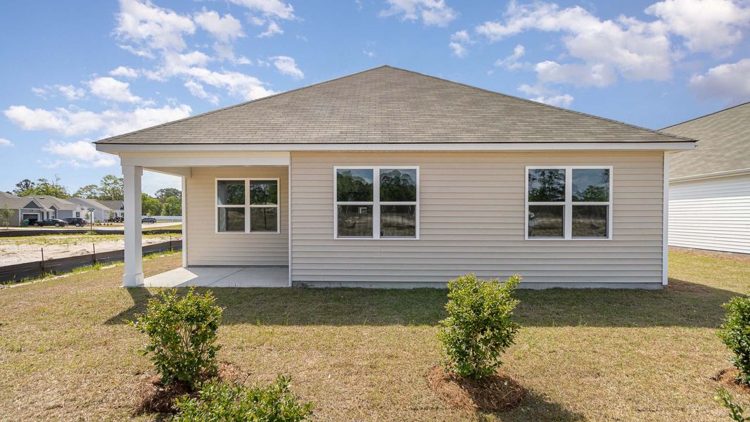 Front exterior of a new home in Heritage Crossing, Conway, SC, highlighting curb appeal (Image 20).