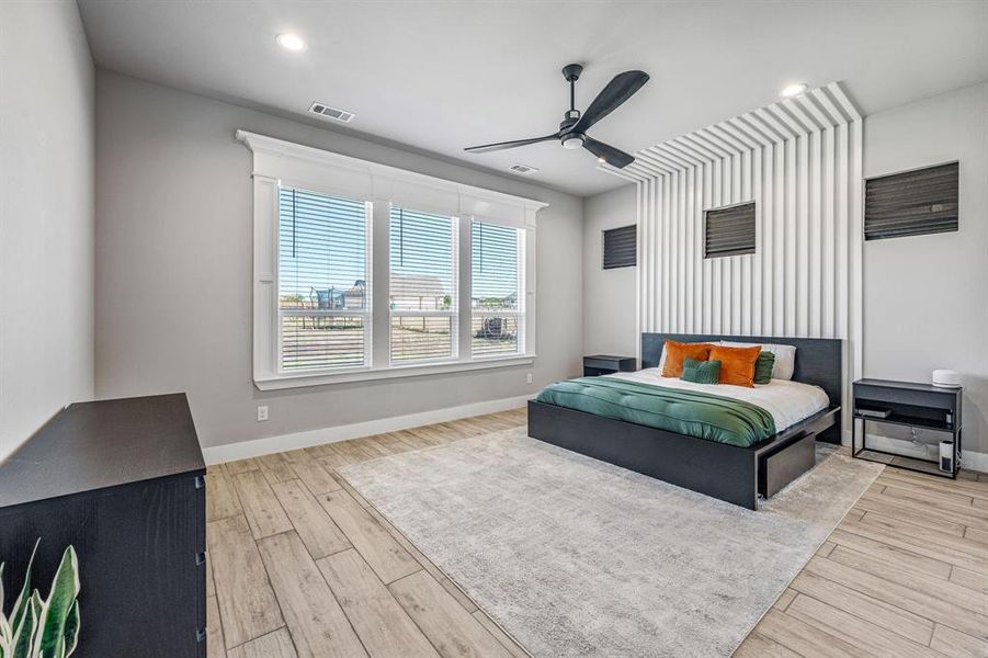 Bedroom with ceiling fan, light wood-style flooring, and recessed lighting