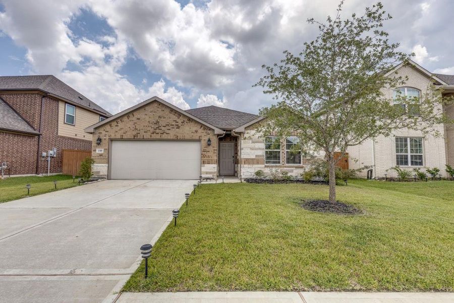Front exterior of a new home in Sierra Vista, Iowa Colony, TX, highlighting curb appeal (Image 20). Front exterior of a new home in Sierra Vista, Iowa Colony, TX, highlighting curb appeal (Image 20).