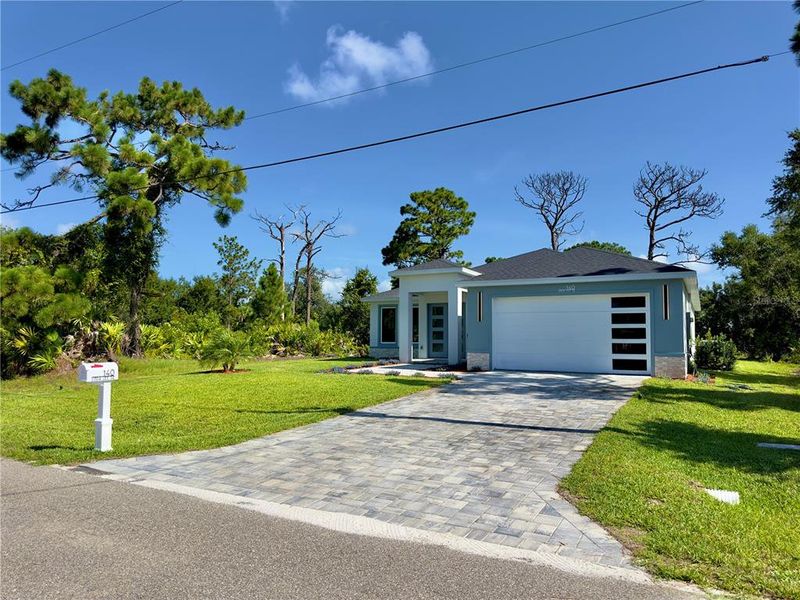 Front exterior of a new home in , Rotonda West, FL, highlighting curb appeal (Image 31). Front exterior of a new home in , Rotonda West, FL, highlighting curb appeal (Image 31).